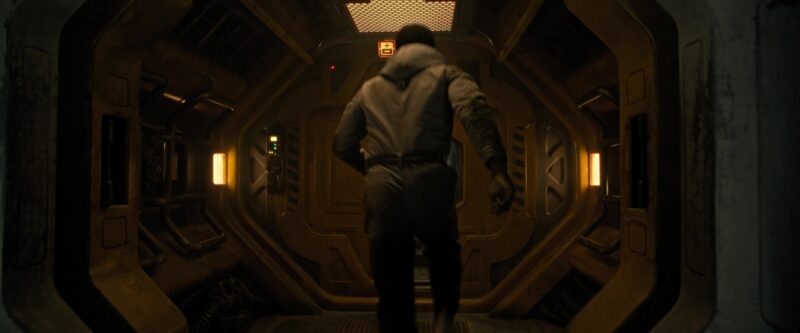 Man running. His back is facing us. 